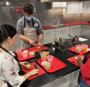 Staff practicing knife skills